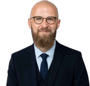 Bedemand Lasse Andersen blåt jakkesæt lyseblå skjorte blåt slips skæg briller skaldet